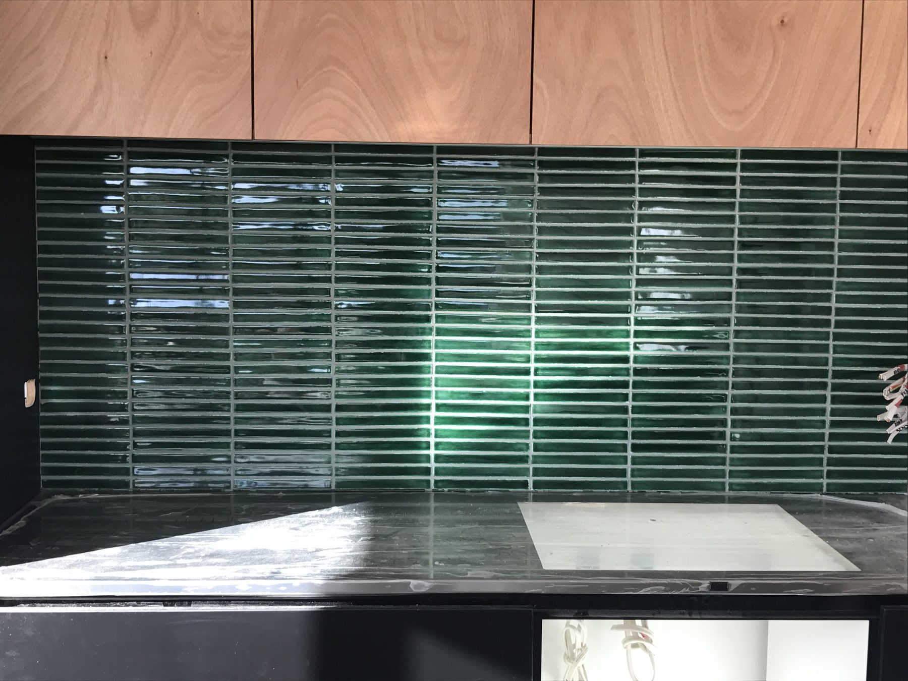 Glossy green finger mosaic kitchen splashback