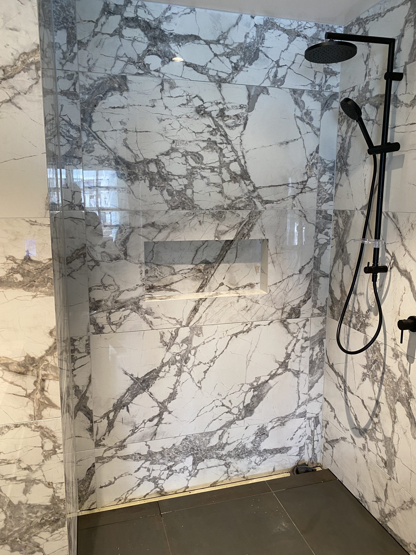 Bookmatched marble-look shower