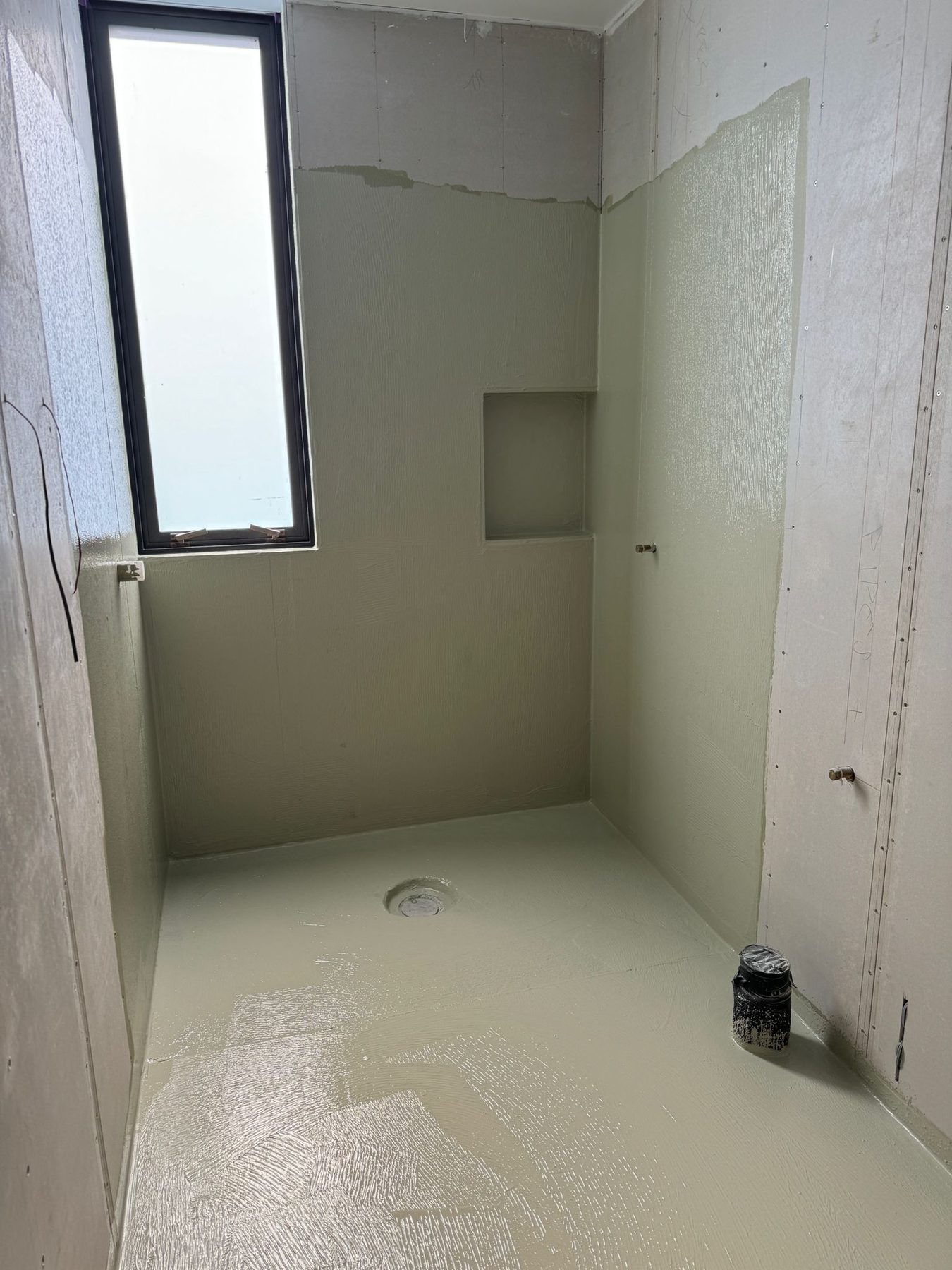 Waterproofing membrane being applied to a shower